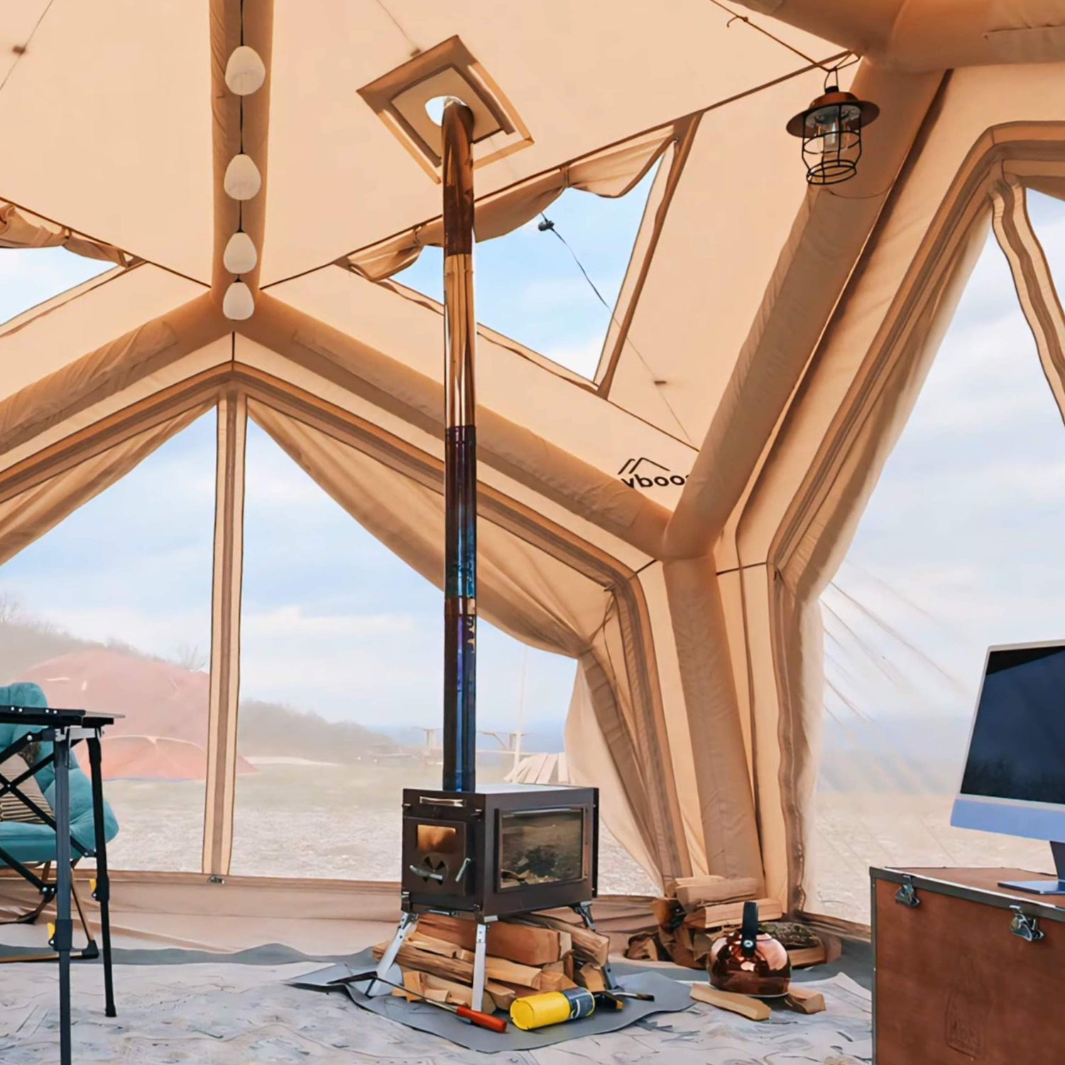 Caminus M 4-season wood stove installed inside canvas tent